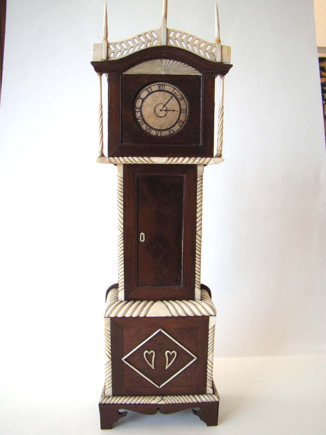 An American Sailor-Made Carved Mahogany and Ivory Tall Case Clock Watch Hutch, probably from Nantucket, circa 1820-1840
